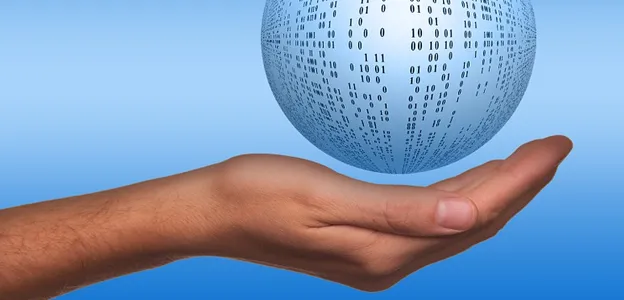 hand holding sphere with binary code